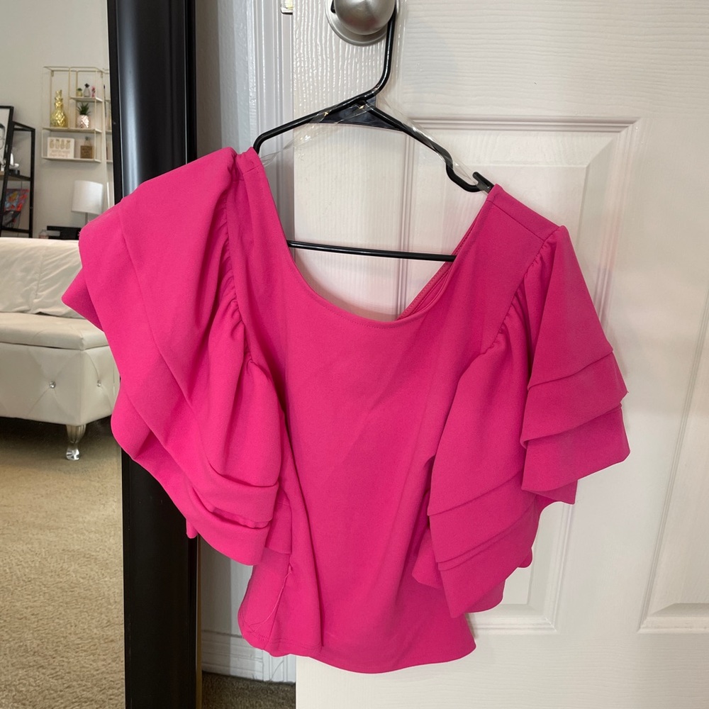Pink Blouse with ruffled sleeves.